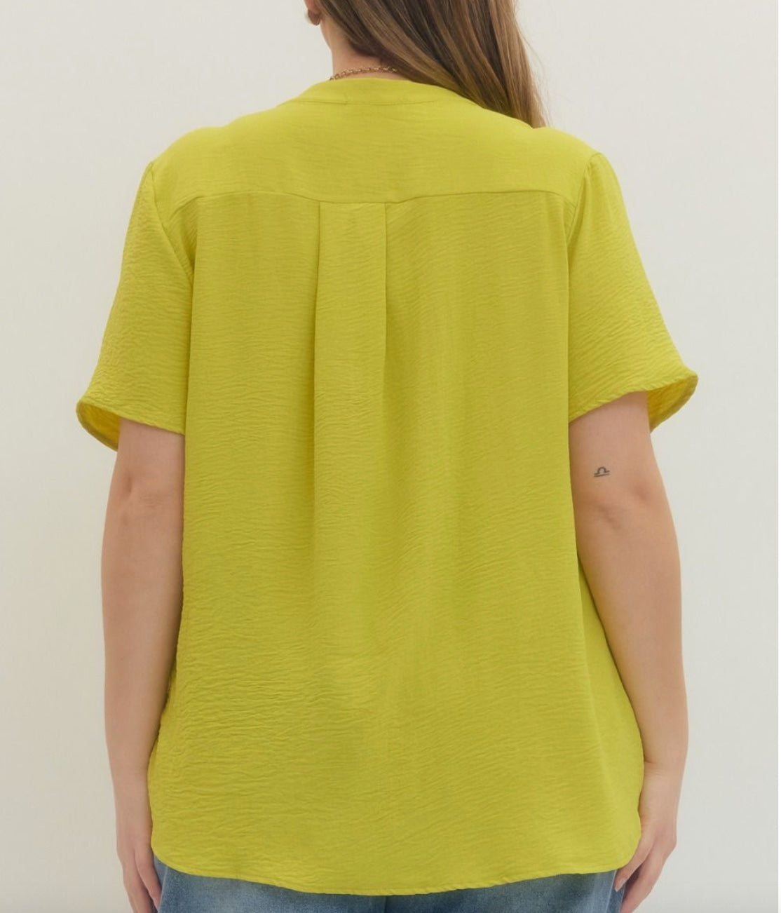 Entro Solid v-neck placket top featuring gathered detail at shoulders in Lime