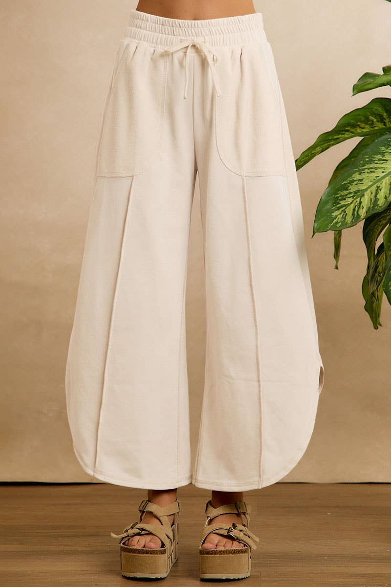 FRENCH TERRY OUT SEAM DETAIL TULIP HEM PANTS