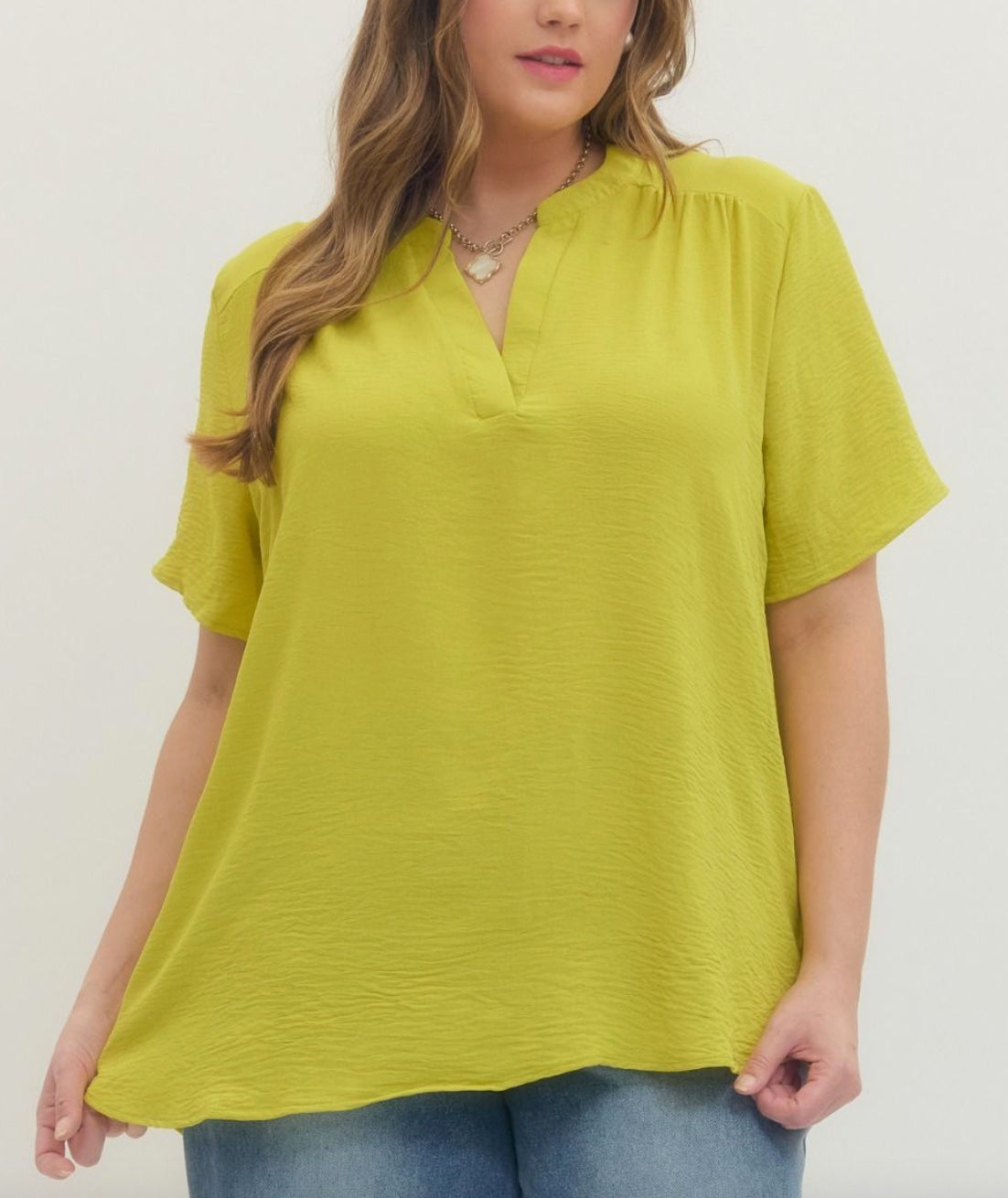 Entro Solid v-neck placket top featuring gathered detail at shoulders in Lime