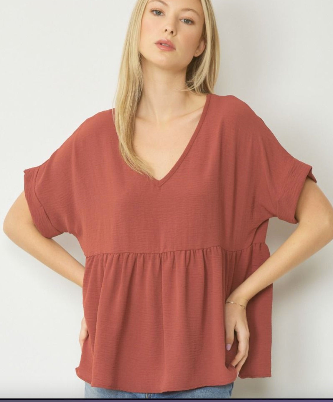 Entro Solid V-neck babydoll top featuring rolled short sleeve band finish Red Brown