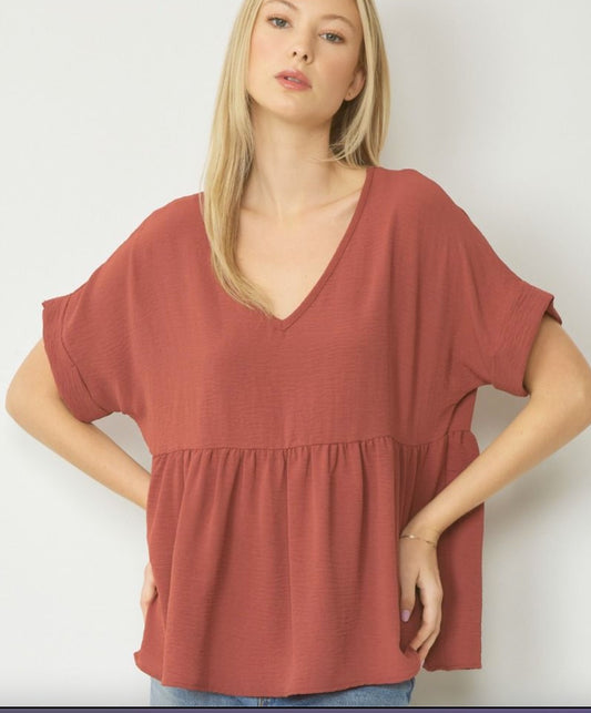 Entro Solid V-neck babydoll top featuring rolled short sleeve band finish Red Brown