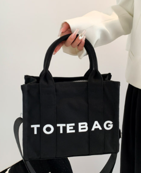 Canvas the tote bag with shoulder strap in Black
